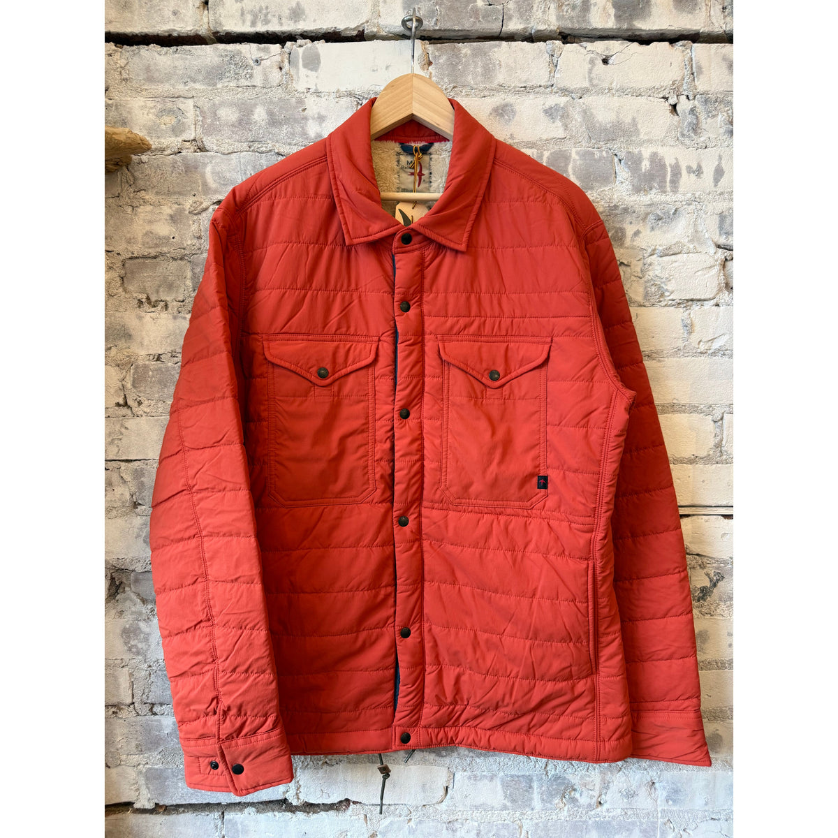 Men's Relwen Qltd Superfleece Jacket in dark orange, showcasing a cozy fleece with a stand-up collar and zip closure.