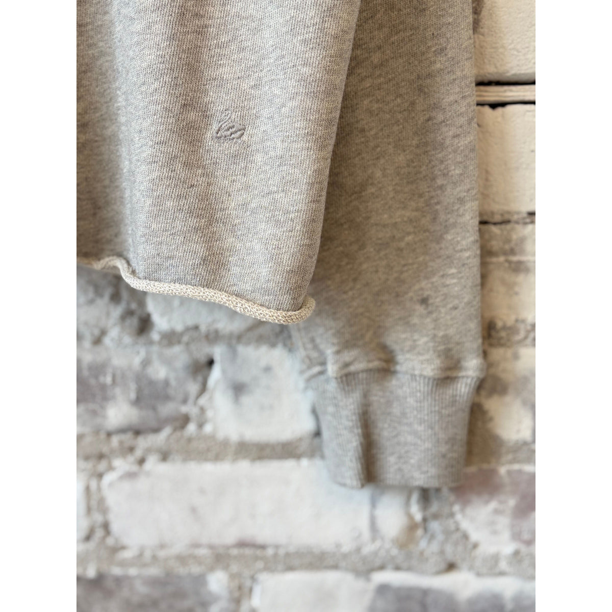 Women's grey melange Retro fleece hoodie with raw hem by Merz b. Schwanen, showing front view and cozy fleece texture.