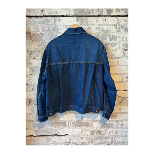 Men's indigo blue denim short jacket by Sage De Cret, featuring a classic fit with visible stitching and button closure.