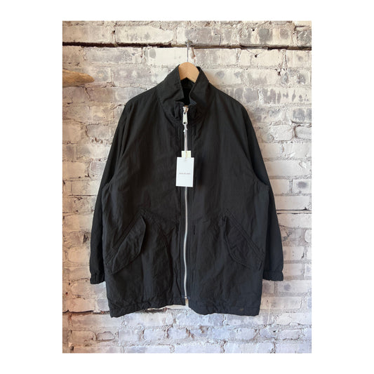 Men's black reversible military jacket by Sage De Cret in high-density twill fabric, showing front and back views.