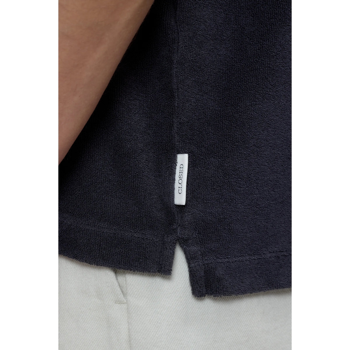 Men's short sleeve polo shirt in Magma Black by Closed Men's, featuring a classic collar and comfortable fit.