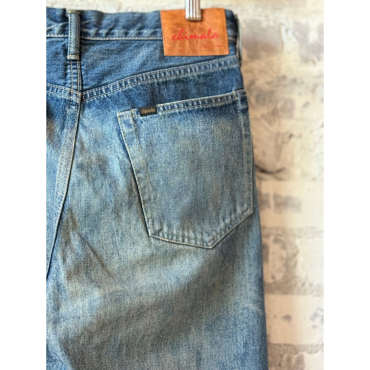 Unisex 13.5oz dark engineer selvedge denim straight cut jeans by Chimala, showing the front view with detailed stitching.