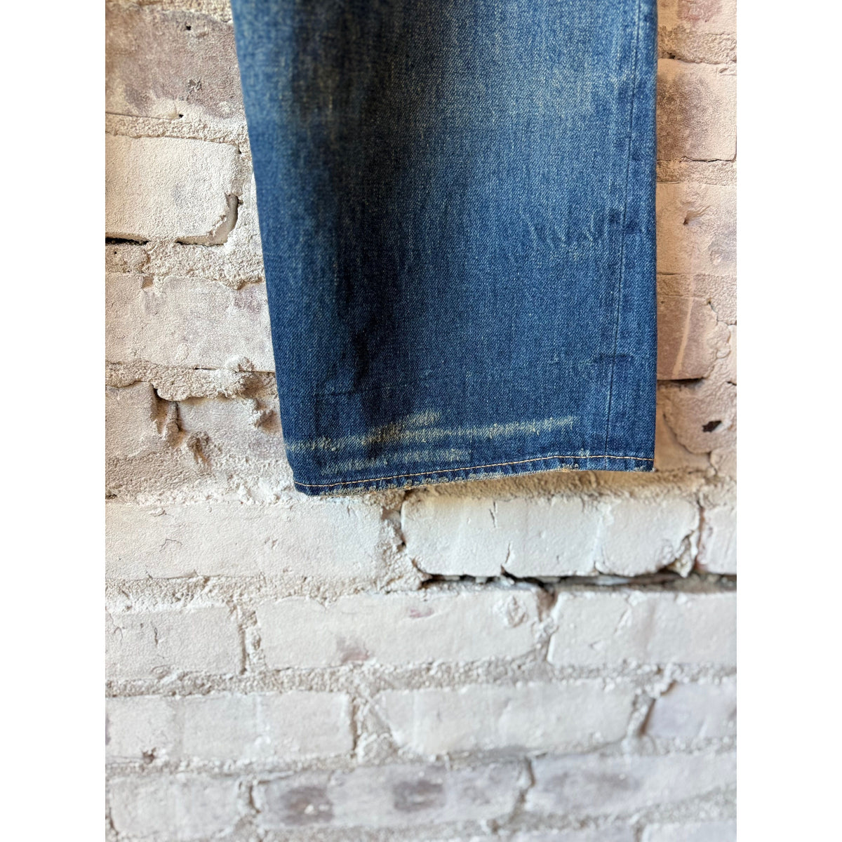 Unisex 13.5oz dark selvedge denim straight-cut jeans by Chimala, showing the fit and dark denim fabric.