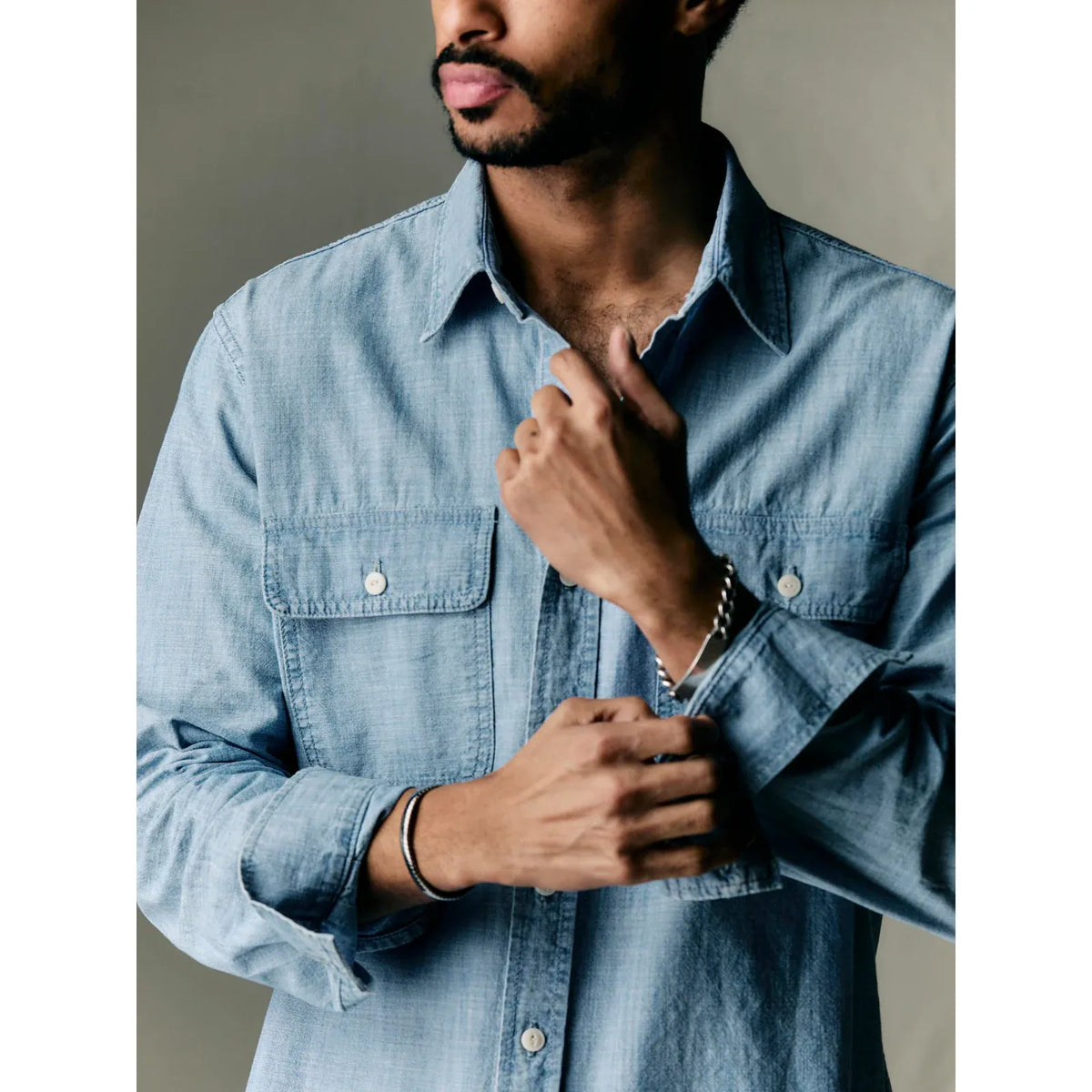 Men's Earl Chambray 2-Pocket Workshirt in Chambray Blue by imogene + willie, shown laid flat with front view.