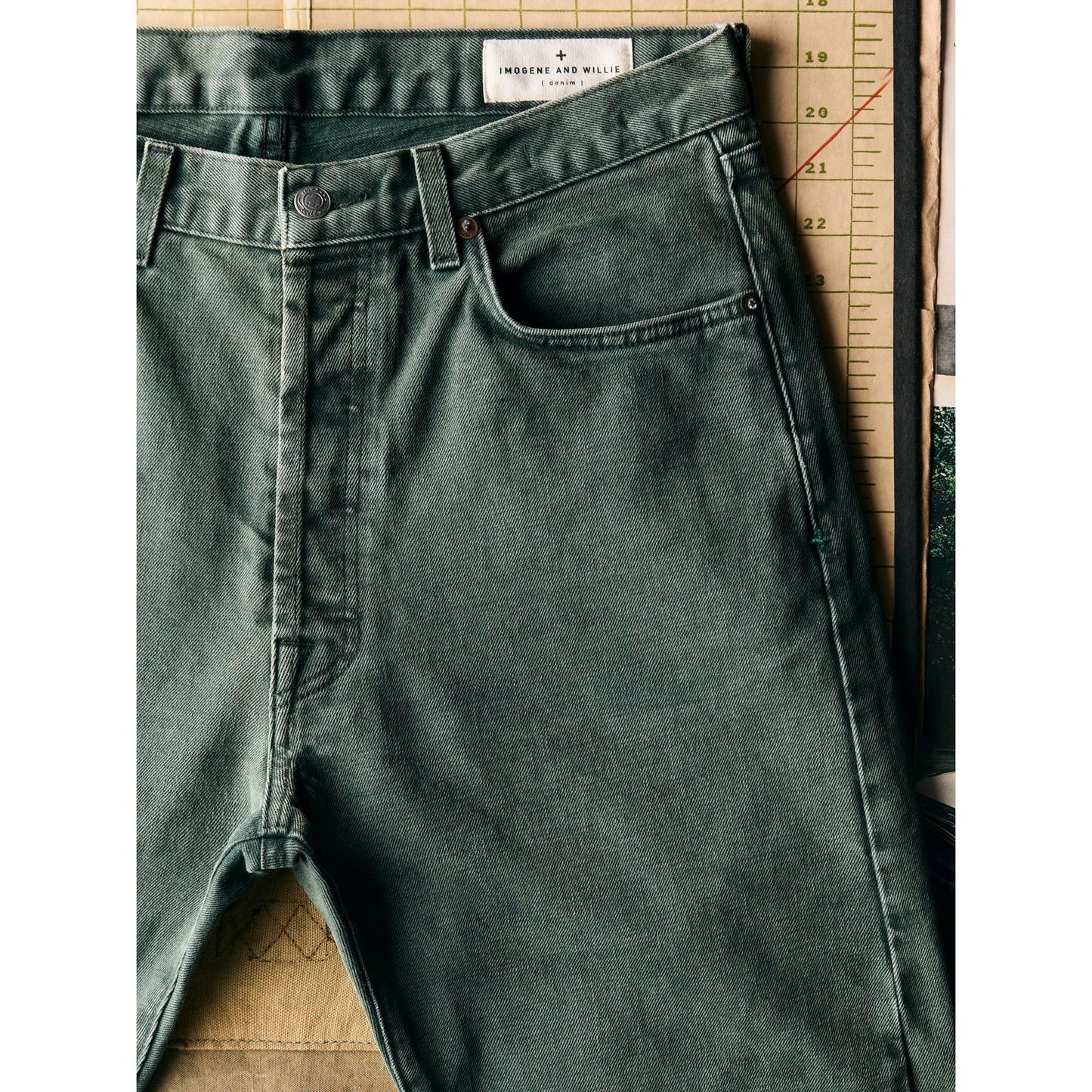 Men's Russell Selvedge Jean in Washed Spruce by imogene + willie, showing the classic denim fabric with a washed greenish hue.