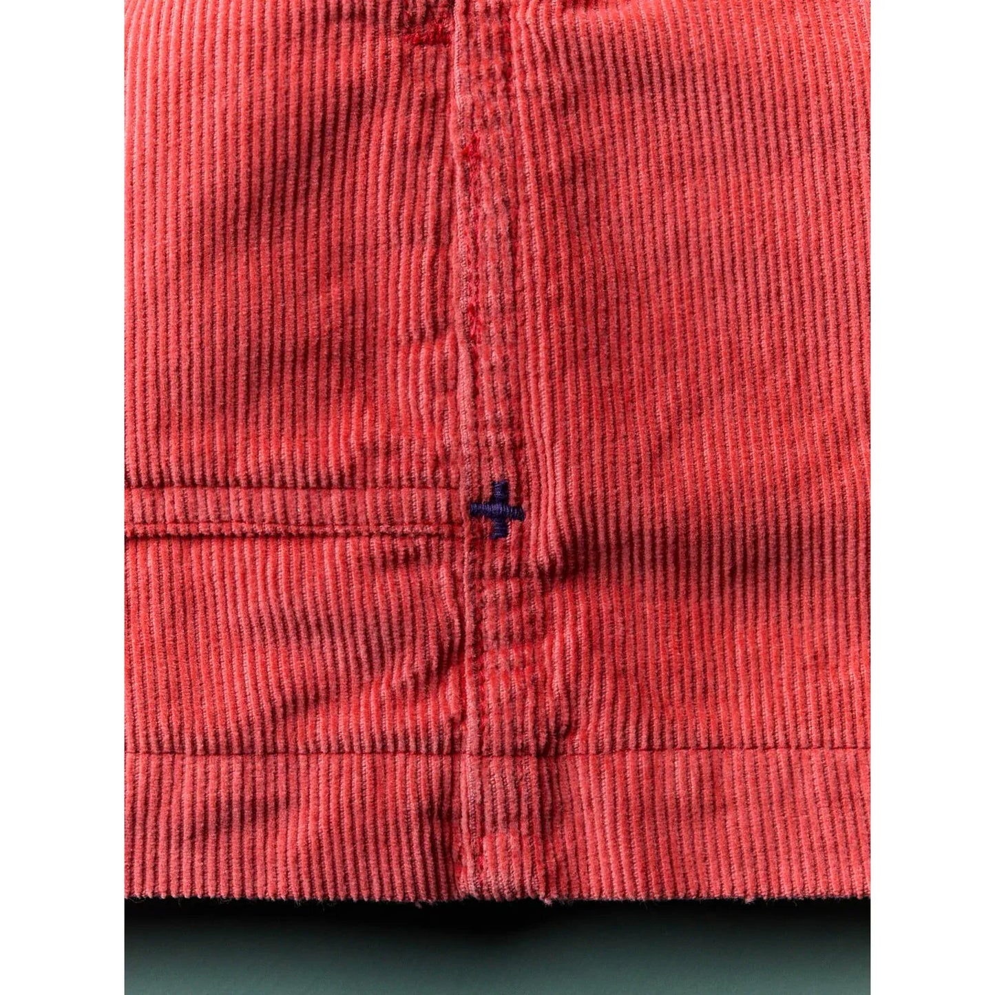 Men's lounge cord short in sunfaded red by imogene + willie, displayed on a model with a relaxed fit and casual style.