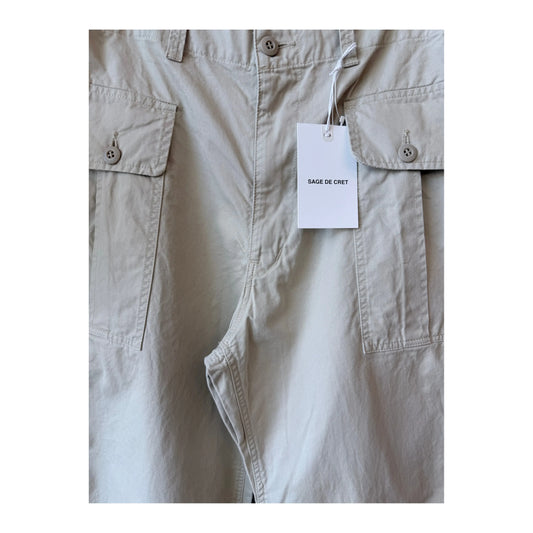 Men's beige Sage De Cret wide chino cloth cargo pants with multiple pockets, relaxed fit, and casual style.