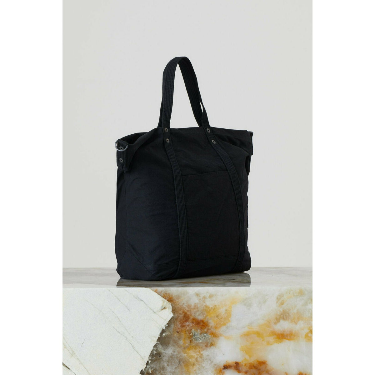 Black cotton canvas tote bag from Closed Men's accessories collection, showing sturdy handles and spacious interior.