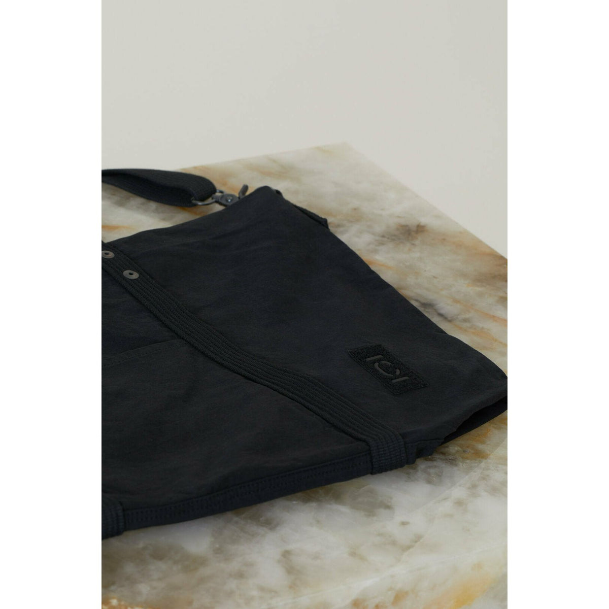 Black cotton canvas tote bag from Closed Men's accessories collection, showing durable fabric and simple design.