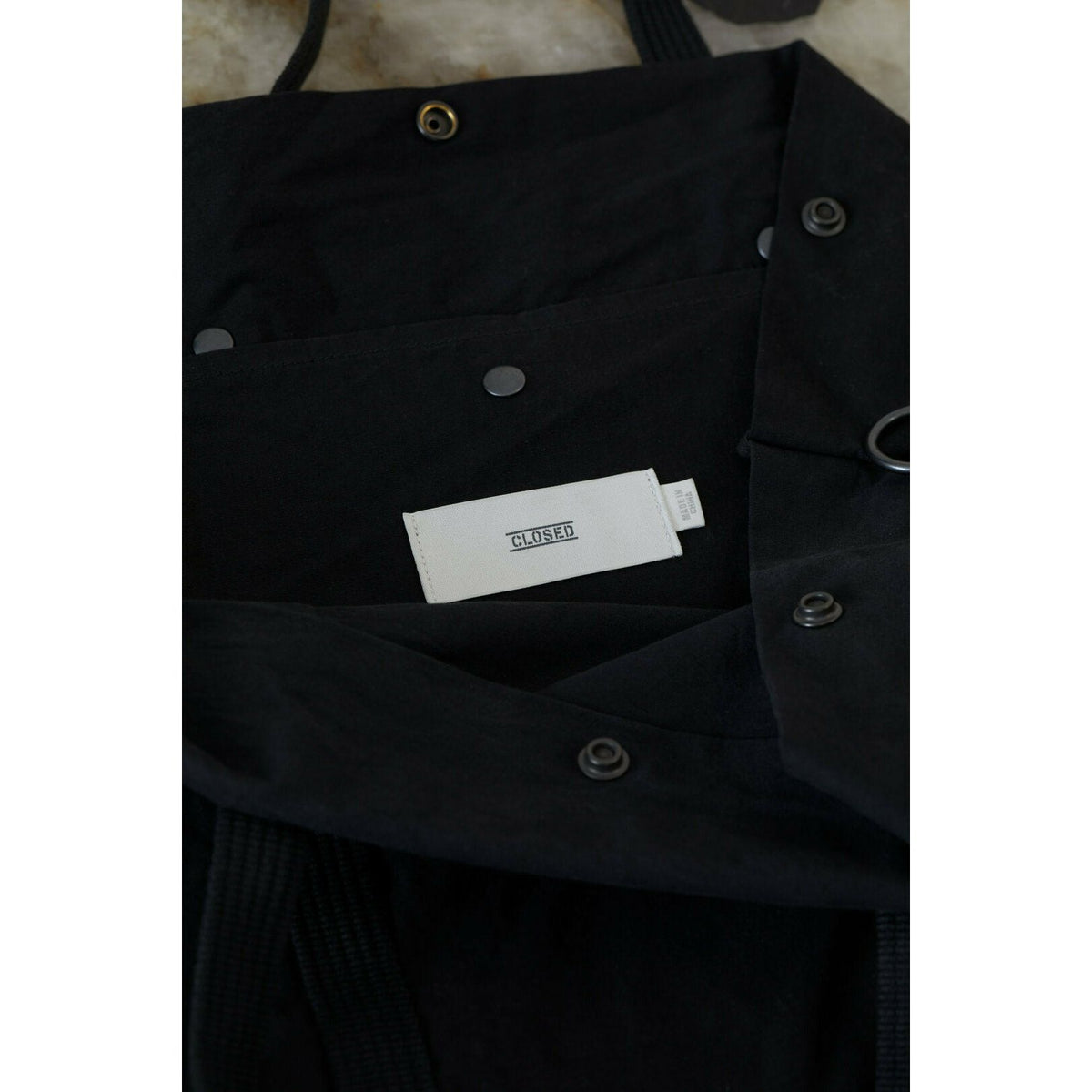 Black cotton canvas tote bag by Closed Men's, featuring sturdy handles and minimalist design for everyday accessories.