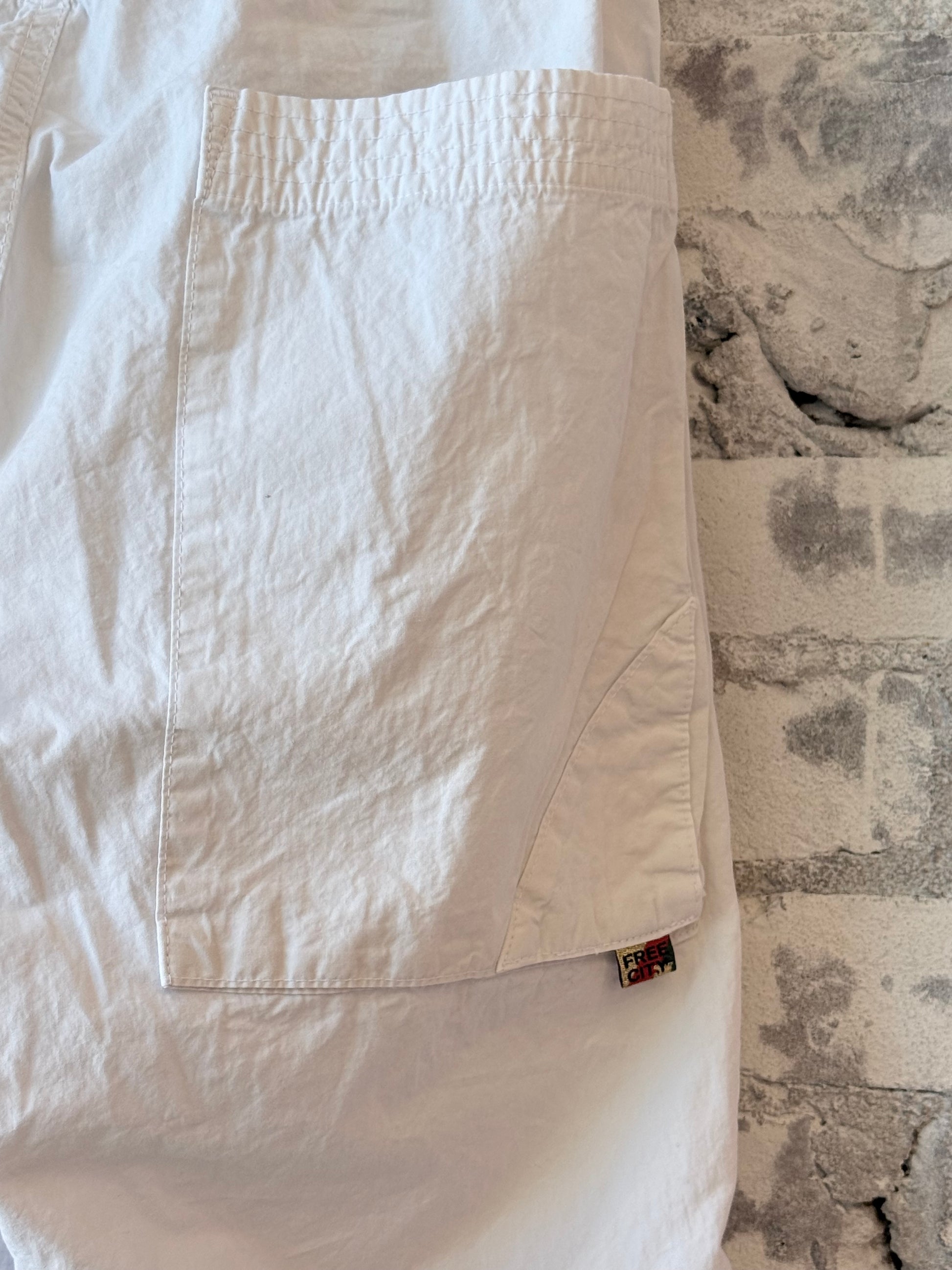 Women's white Homestud Outofsight Poplinair Flapsnap Kite Pants by Freecity, featuring a relaxed fit and stylish design.