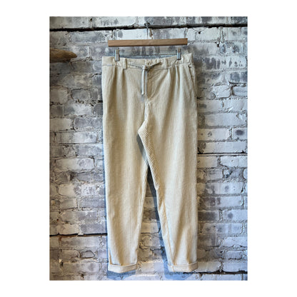 Men's beige corduroy joggers from 04651, featuring a relaxed fit and soft textured fabric, ideal for casual wear.