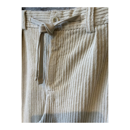 Men's beige corduroy joggers with a relaxed fit and elastic waistband, casual style, made by 04651/.