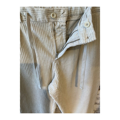 Men's beige corduroy joggers with an elastic waistband and side pockets, casual and comfortable for everyday wear.