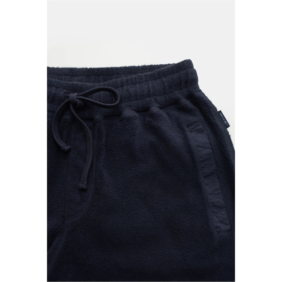 Men's navy PF fleece sweatpants by 04651, featuring a relaxed fit and soft fleece material, shown on a model.