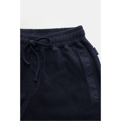 Men's navy PF fleece sweatpants by 04651, featuring a relaxed fit and soft fleece material, shown on a model.
