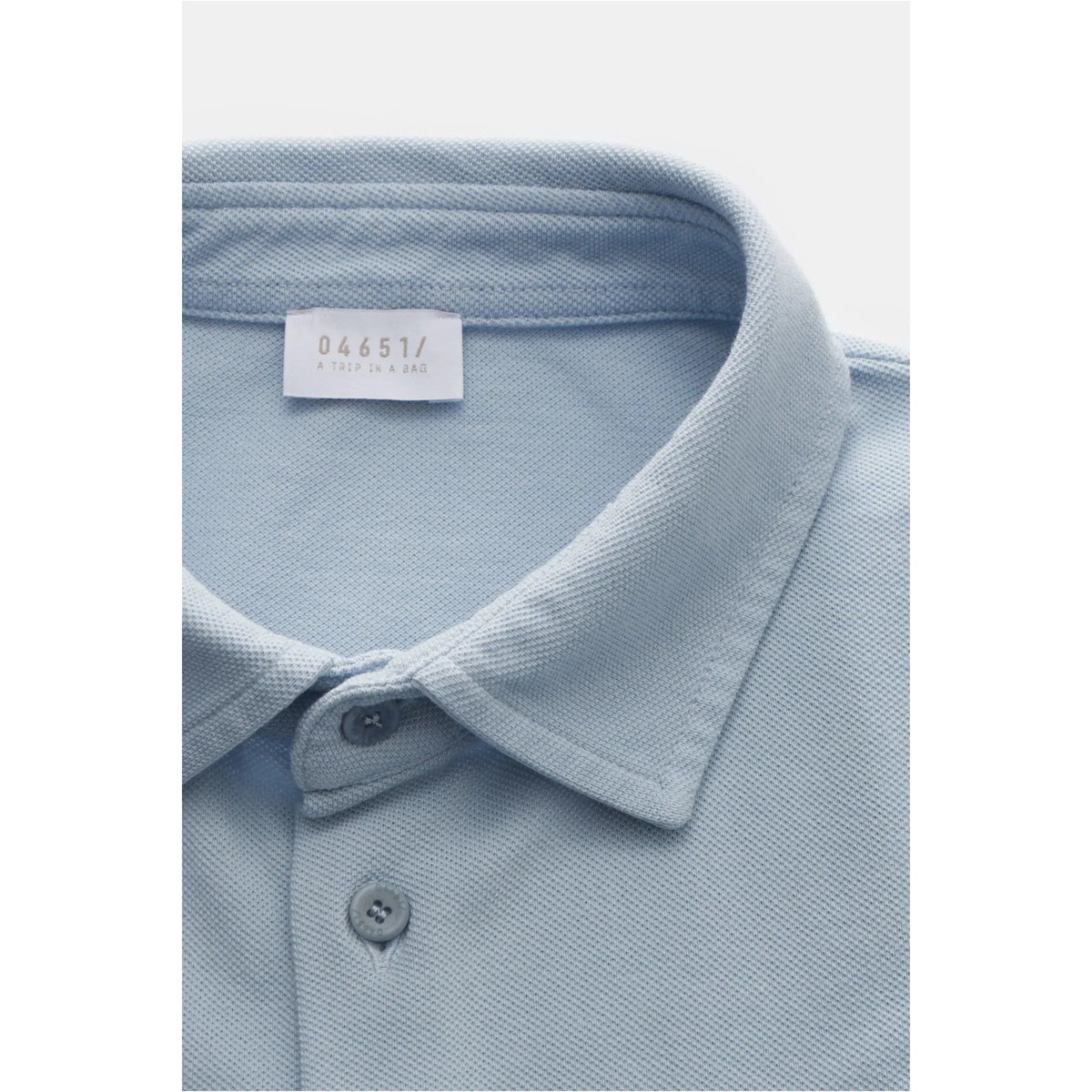 Men's Piqué Slim Collar Shirt in sky blue by 04651, featuring a classic polo design and long sleeves.