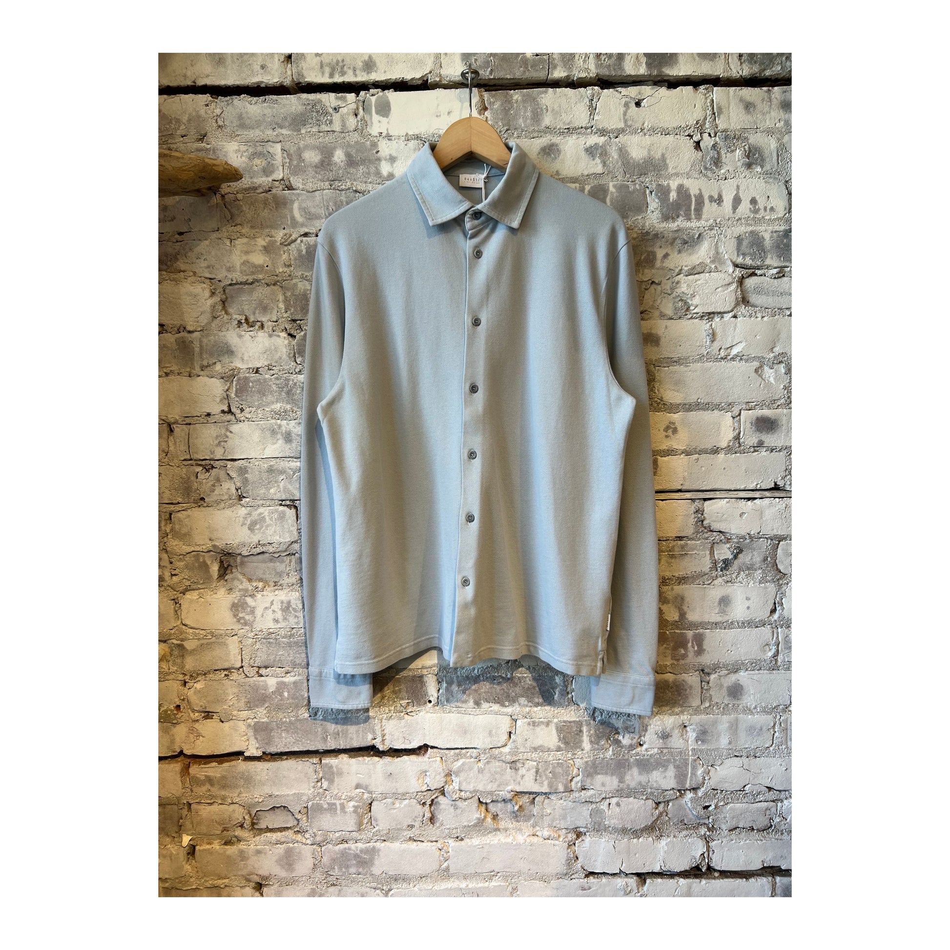 Men's Piqué Slim Collar Shirt in Sky color, made by 04651, featuring a classic fit and textured fabric for casual or smart wear.