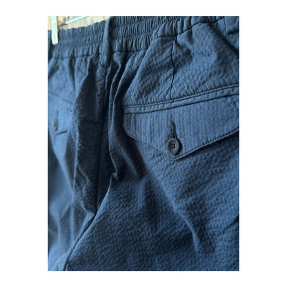 Men's navy seersucker Bermuda shorts with a relaxed fit and textured fabric, ideal for casual summer wear.