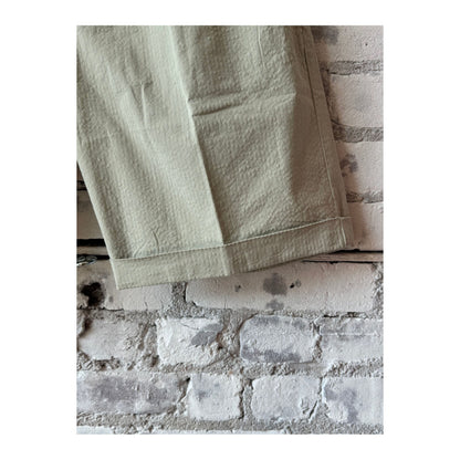 Men's seersucker Bermuda shorts in sand color, featuring lightweight, breathable fabric and a classic fit for casual summer wear.
