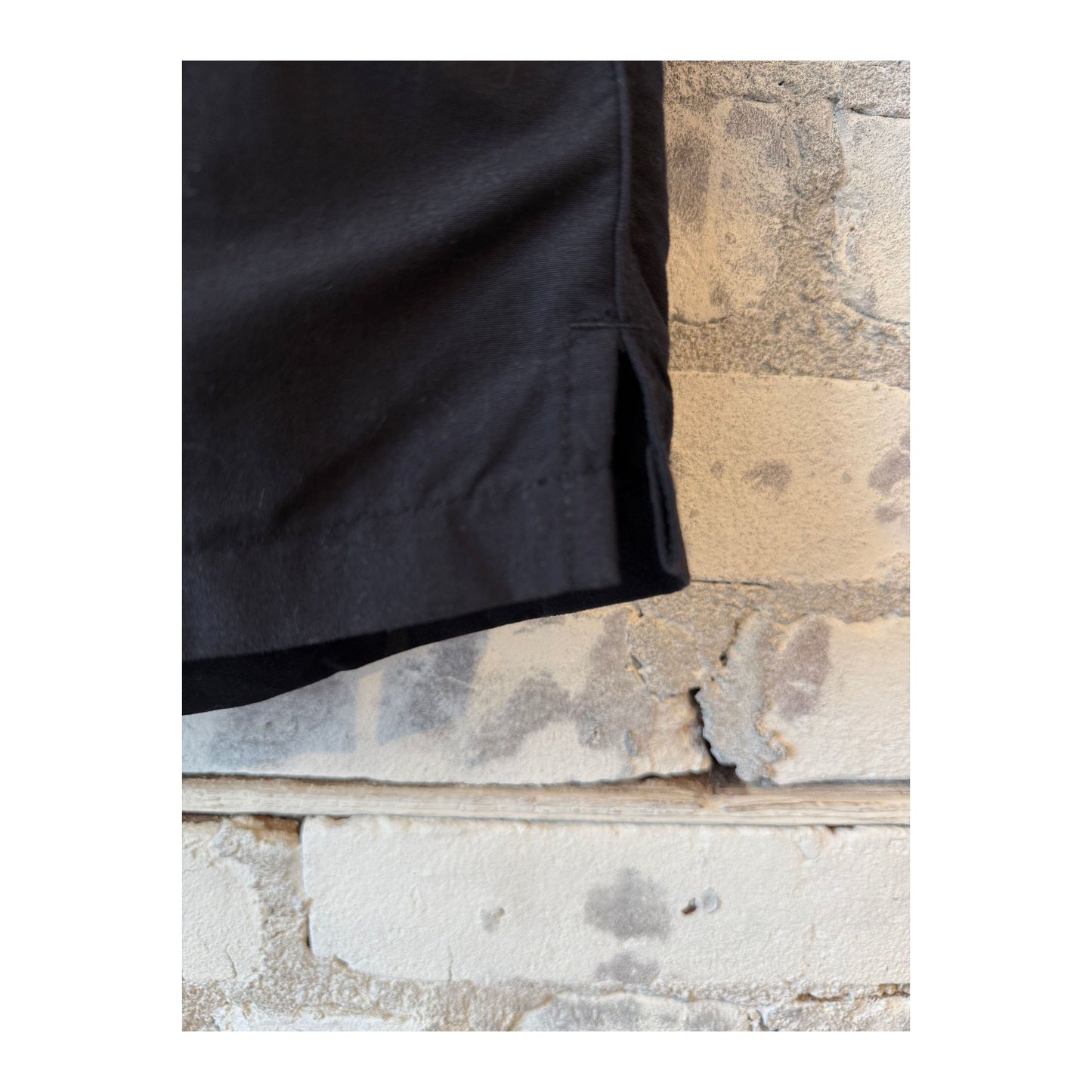 Men's black swim shorts with adjustable waistband and side pockets, made by brand 04651/.
