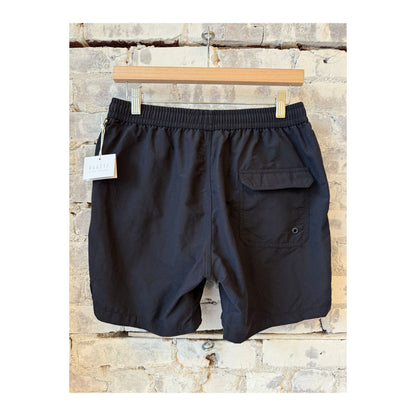 Men's black swim shorts with elastic waistband and side pockets, designed for comfortable beach and pool wear.