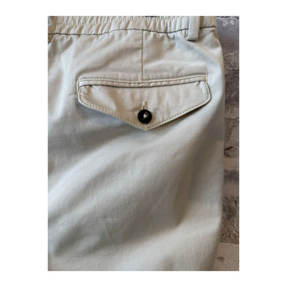 Men's beige twill pants with a relaxed fit, featuring belt loops and side pockets, from the 04651 brand.