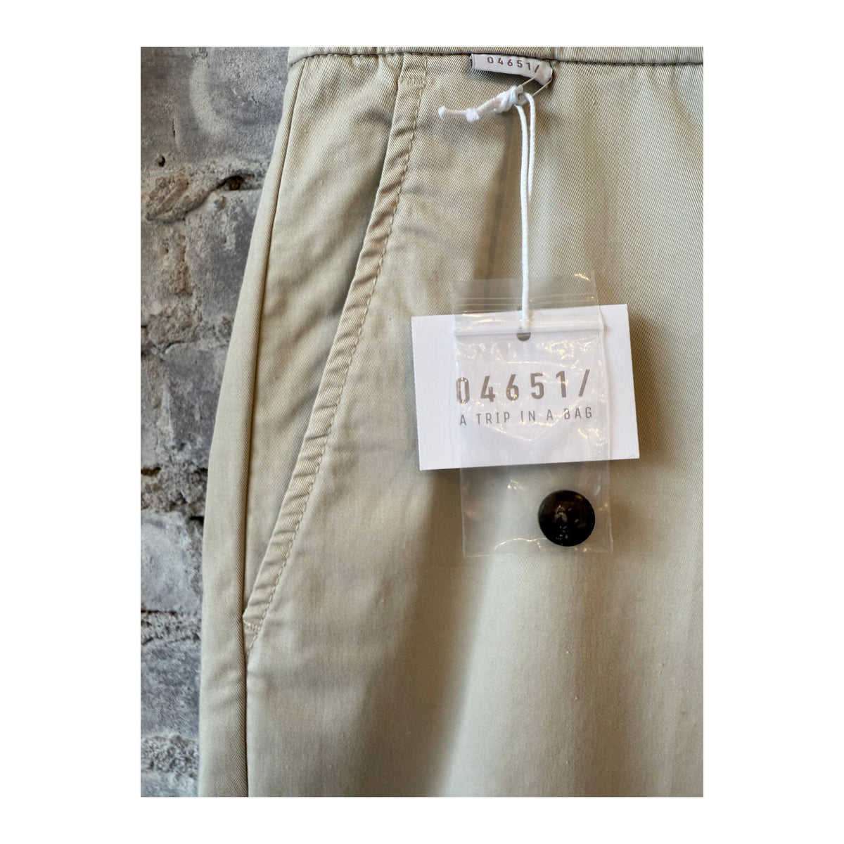 Men's beige twill pants by 04651, featuring a relaxed fit and classic design, shown on a neutral background.