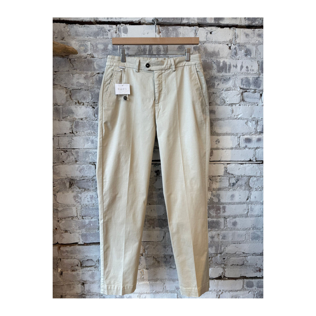 Men's beige twill pants from 04651, featuring a tailored fit and classic style, with visible front pockets and belt loops.