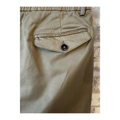 Men's taupe twill pants with a classic fit and belt loops, casual style, shown on a model.