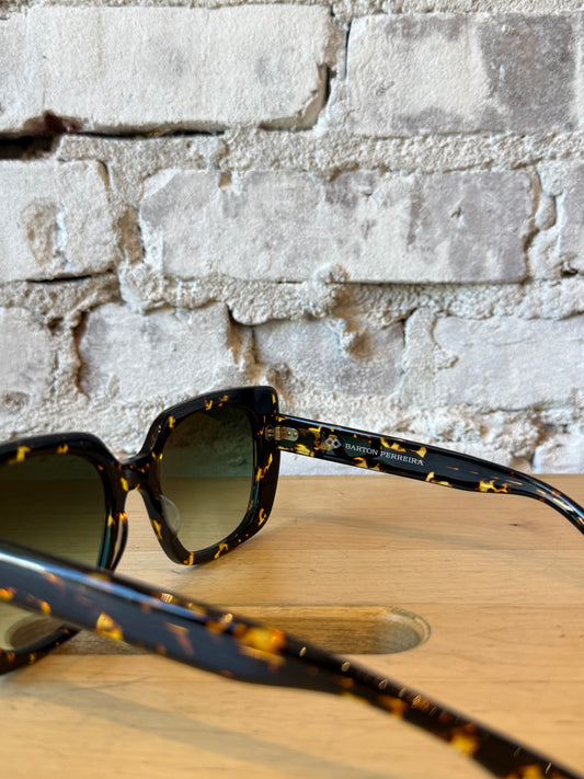 Women's Barton Perreira Yasmeen Sunglasses in Heroine Chic / Julep style with bold, oversized frames and dark tinted lenses.