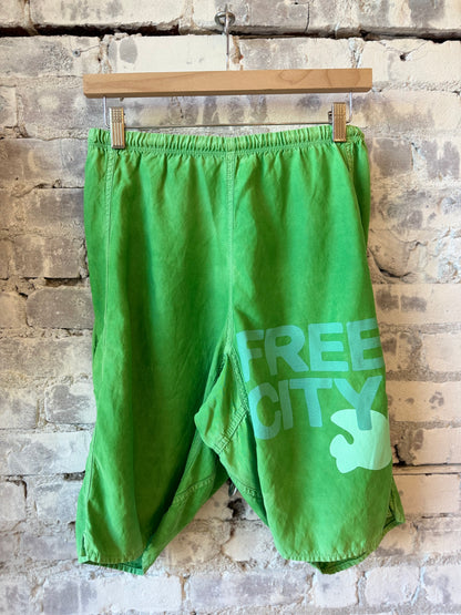 Women's Freecity matte satin back pocket shorts in Grasshopper Powder, featuring a stylish design and comfortable fit.