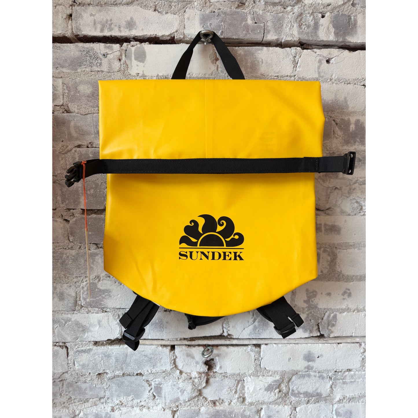 Men's summer yellow Sundek 20-liter water-resistant technical backpack with multiple compartments and padded shoulder straps.