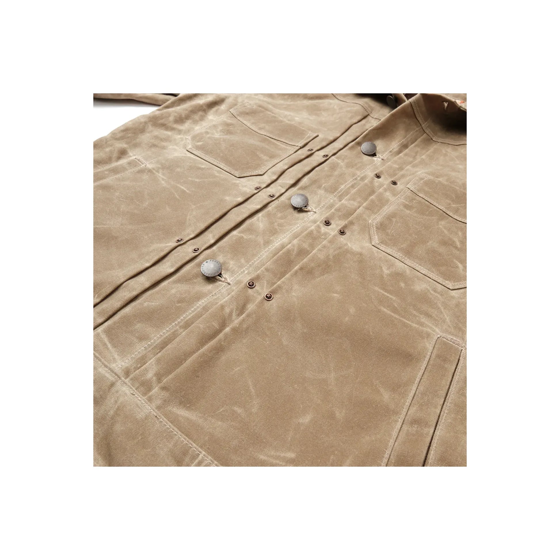 Men's waxed canvas Riders Jacket in tobacco brown by Freenote Cloth, showcasing rugged texture and classic motorcycle-inspired style.