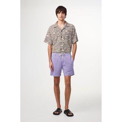 Men's Gregor Lyocell Blend Shorts in violet by NN07, featuring a relaxed fit and casual style, shown on a model.