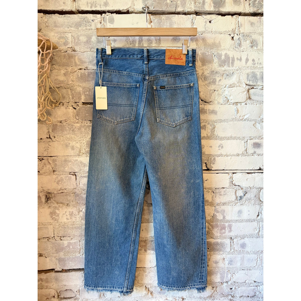 Women's 13.5oz dark distress selvedge denim narrow straight jeans by Chimala, featuring a fitted cut and distressed details.