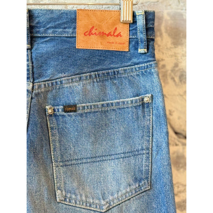 Women's 13.5oz dark distressed selvedge denim narrow straight jeans by Chimala, showcasing a fitted cut with subtle distressing.