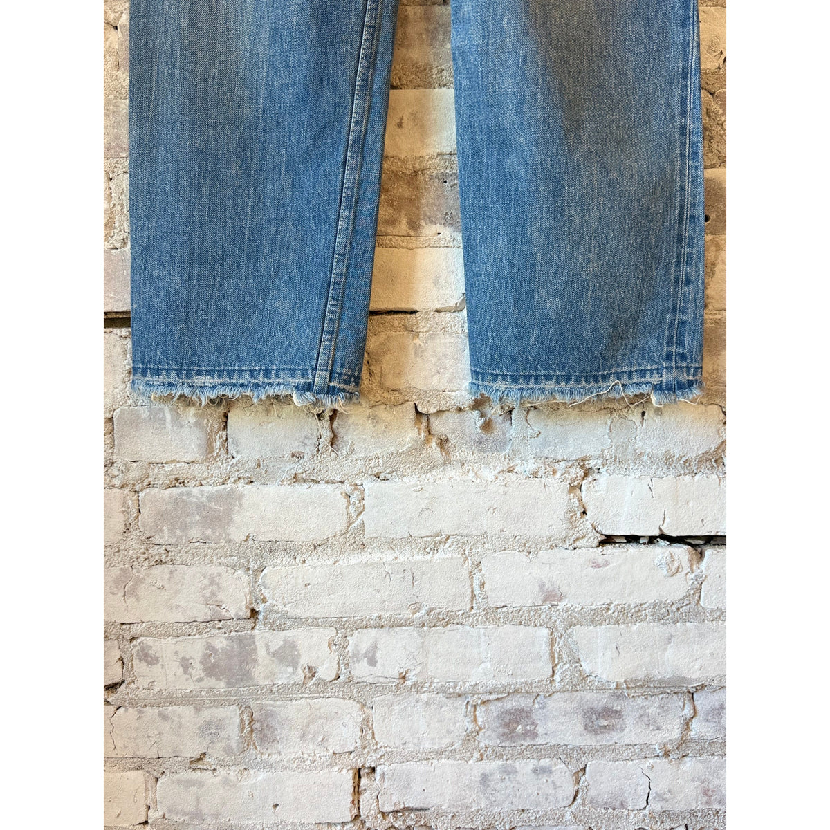 Women's dark distress selvedge denim narrow straight cut jeans by Chimala, showcasing fitted style and detailed distressing.