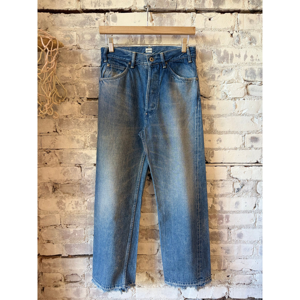 Women's Chimala 13.5oz selvedge denim narrow straight cut jeans in dark distress with subtle fading and distressed details.
