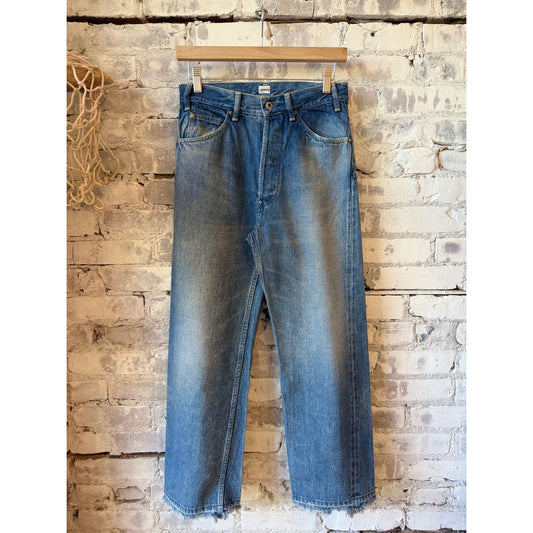 Women's 13.5oz dark distressed selvedge denim narrow straight jeans by Chimala, showcasing the fit and textured denim fabric.