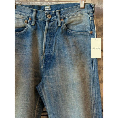 Women's 13.5oz Chimala selvedge denim ankle jeans with medium distress and used wash, showcasing detailed distressed and cuffed hem.