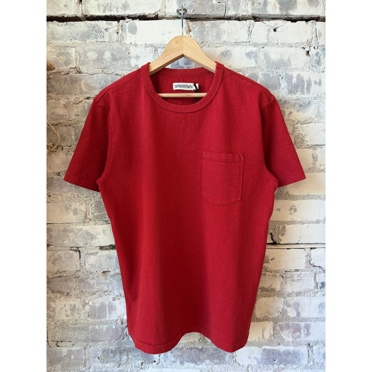 Red men's 13-ounce pocket T-shirt by Freenote Cloth, featuring a front pocket and casual fit.