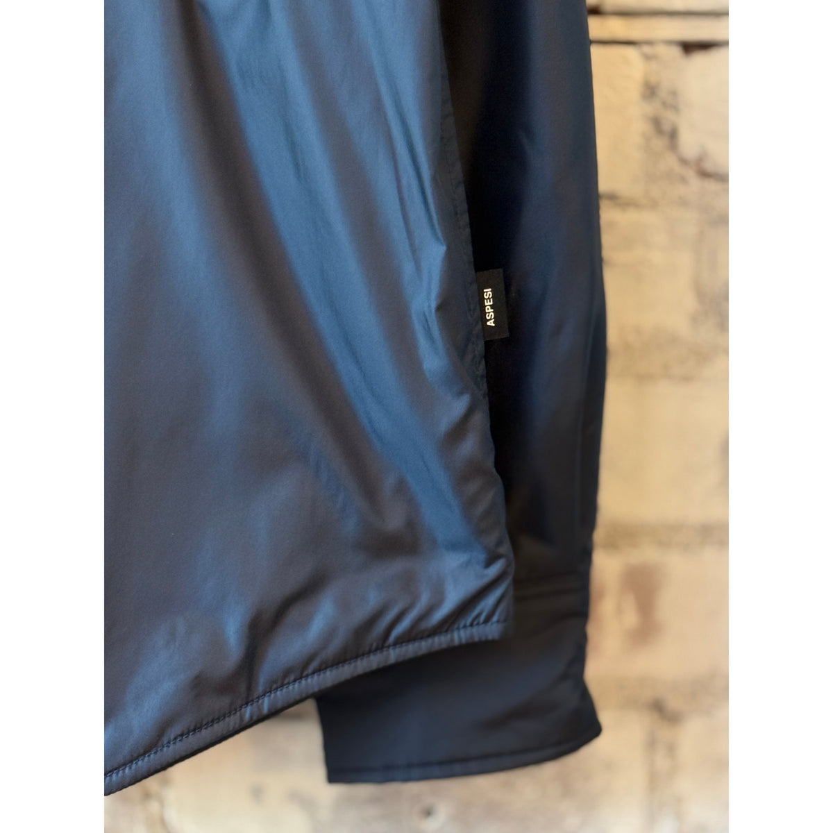 Men's navy 13 Piu shirt by Aspesi, lightweight cotton with a classic collar and button-up front, displayed on a hanger.