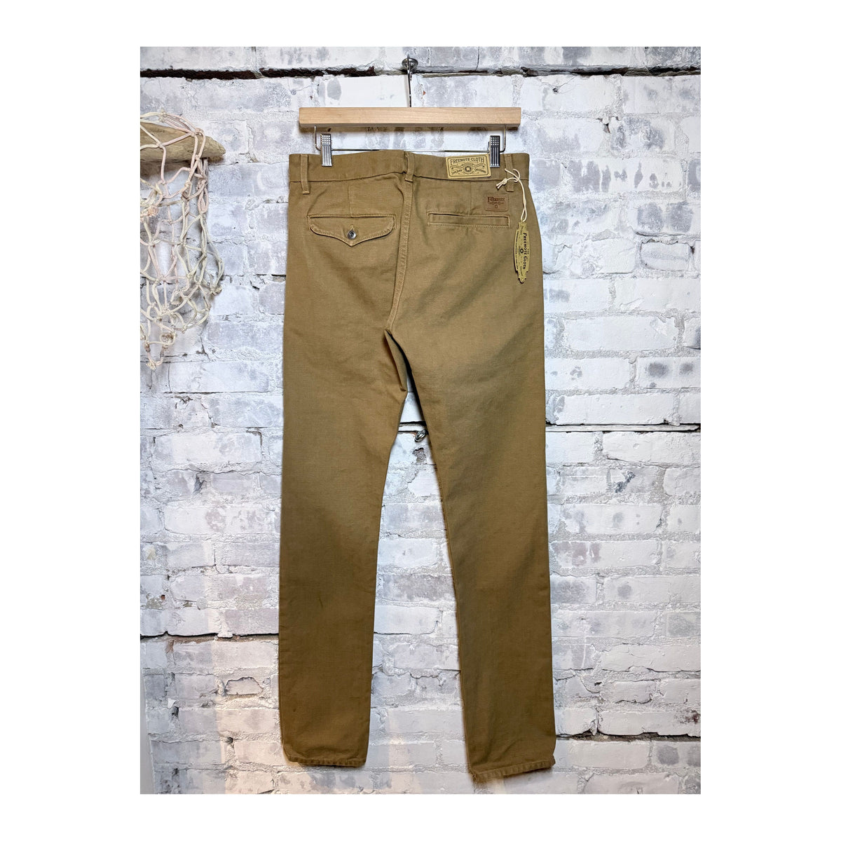 Men's tan 14-ounce slub worker's chino jeans by Freenote Cloth, showcasing durable fabric and classic fit.
