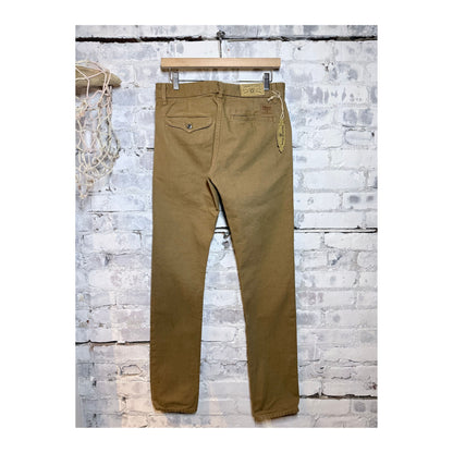 Men's tan 14-ounce slub worker's chino jeans by Freenote Cloth, showcasing durable fabric and classic fit.