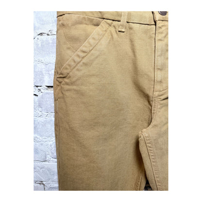 Men's 14-ounce tan slub workman's chino pants by Freenote Cloth, showing the textured fabric and relaxed fit.