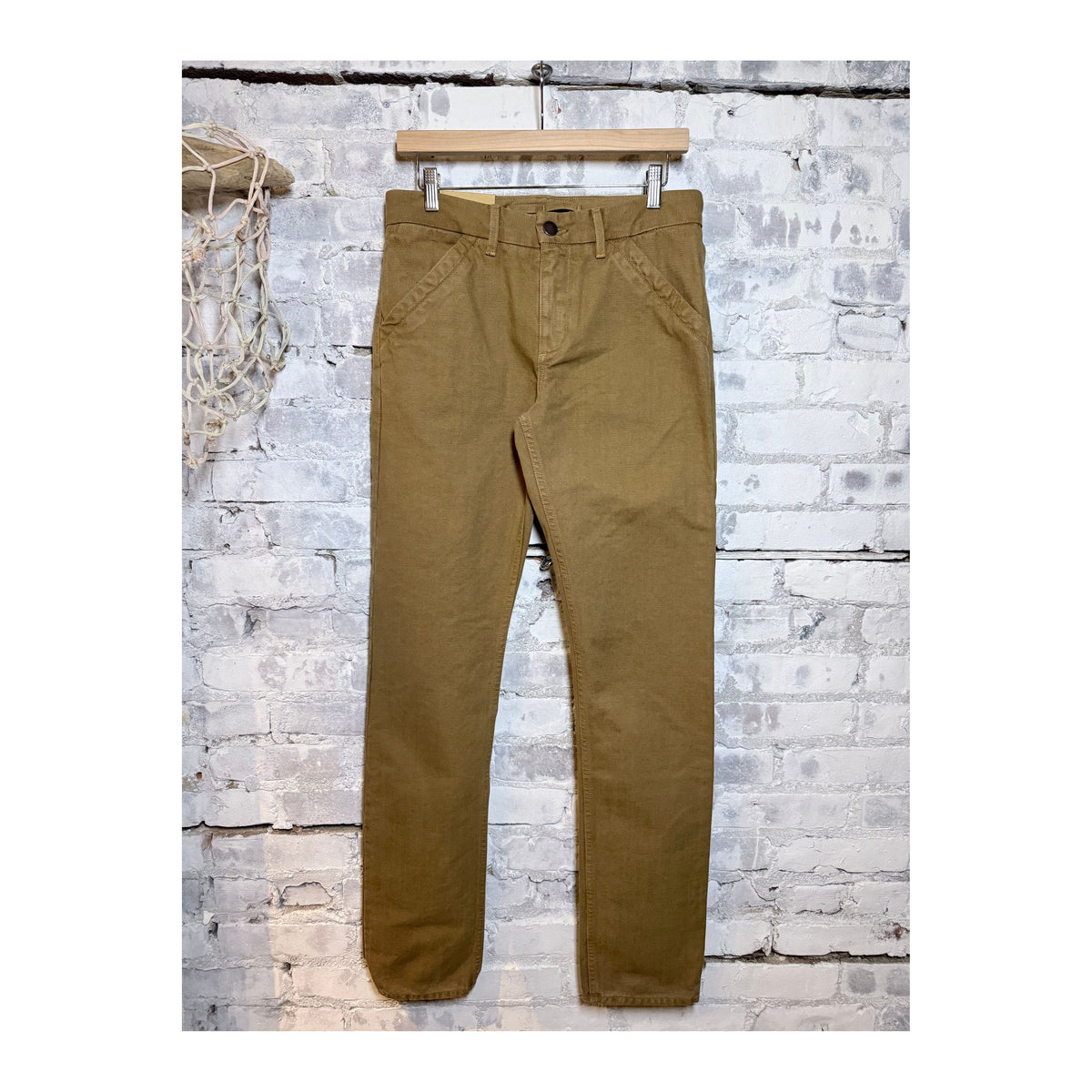 Men's tan 14-ounce slub workman's chino pants by Freenote Cloth, showing the relaxed fit and durable fabric detail.
