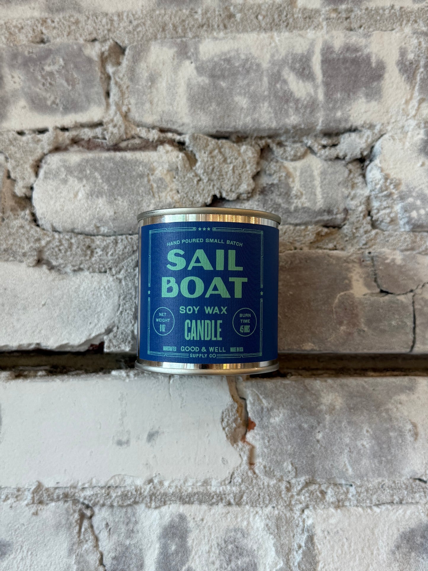 Sailboat soy candle by Good & Well Supply Co. in a glass holder, perfect for home decor and creating a cozy atmosphere