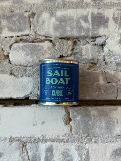 Sailboat soy candle by Good & Well Supply Co. in a glass holder, perfect for home decor and creating a cozy atmosphere