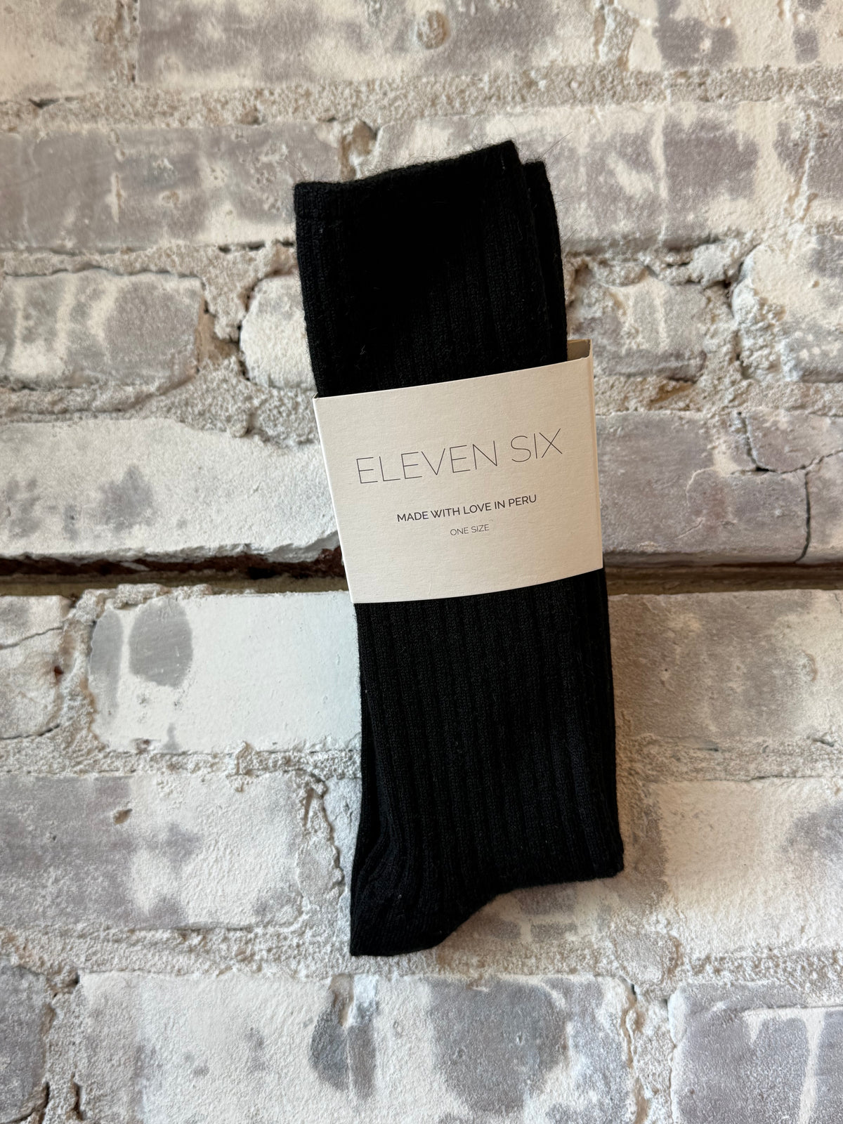 Women's black Ali Ribbed Socks by ELEVEN SIX, featuring a textured ribbed knit design for comfortable everyday wear.